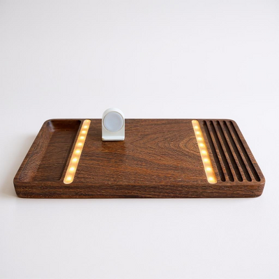 Close-up of warm LED strip integrated into wooden wireless charging dock
