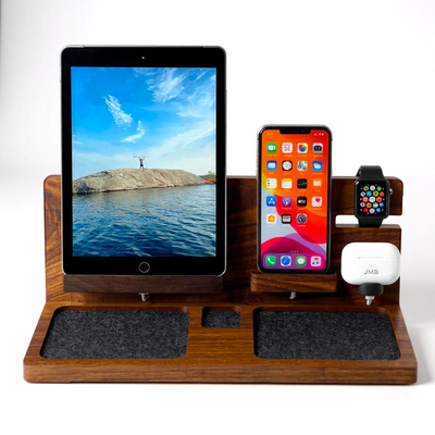 4-in-1 wooden Apple charging station with iPhone, iPad, Apple Watch, and AirPods docked, handcrafted walnut dock on modern desk